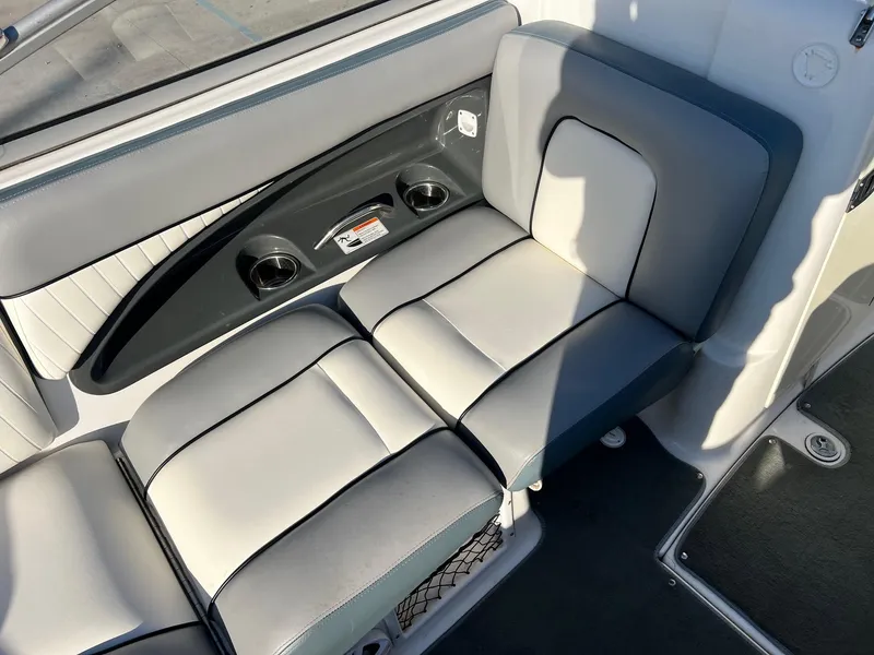 Slide: The Image of 2008 Yamaha Boats SX230 High Output interior seating with cup holders and storage. - 5