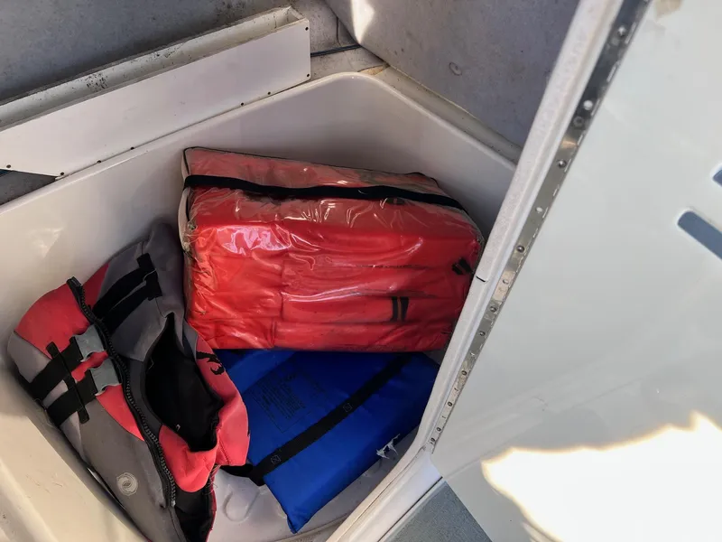 Slide: The Image of Storage compartment in a 2008 Yamaha SX230 High Output boat with life jackets. - 7
