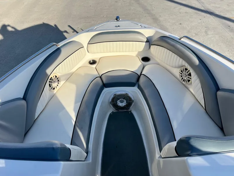 Slide: The Image of 2008 Yamaha SX230 High Output boat interior with cushioned seating and speakers. - 8