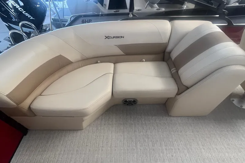 Slide: The Image of 2022 Xcursion 223 RFX boat seating with beige and brown upholstery. - 10