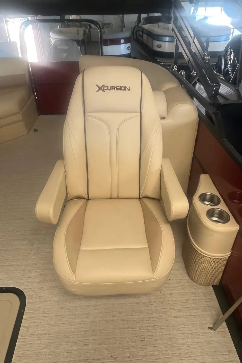 Slide: The Image of 2022 Xcursion 223 RFX boat seat with cup holders, beige upholstery. - 7