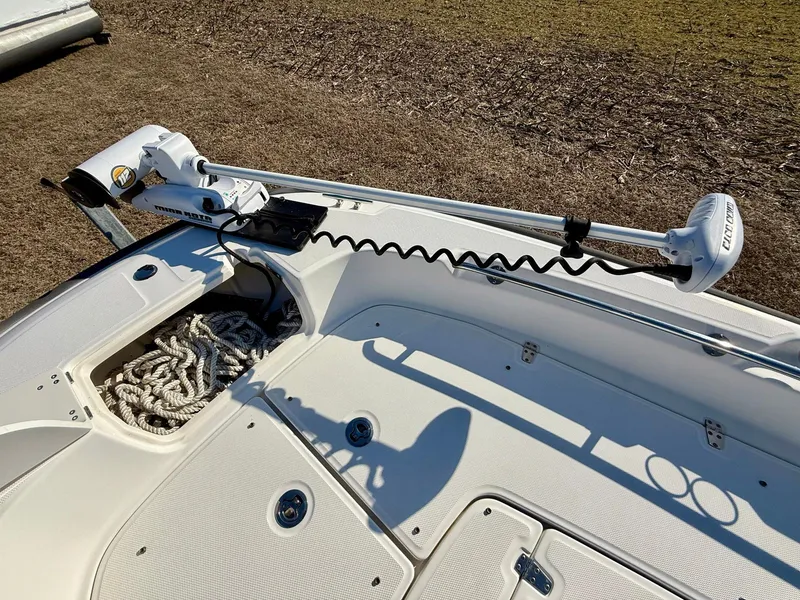 Slide: The Image of 2016 Boston Whaler 240 Dauntless boat deck with trolling motor and rope storage. - 11