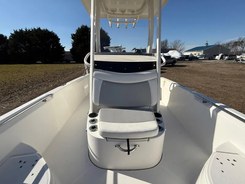 Slide: The Image of 2016 Boston Whaler 240 Dauntless boat interior with seating and rod holders. - 13