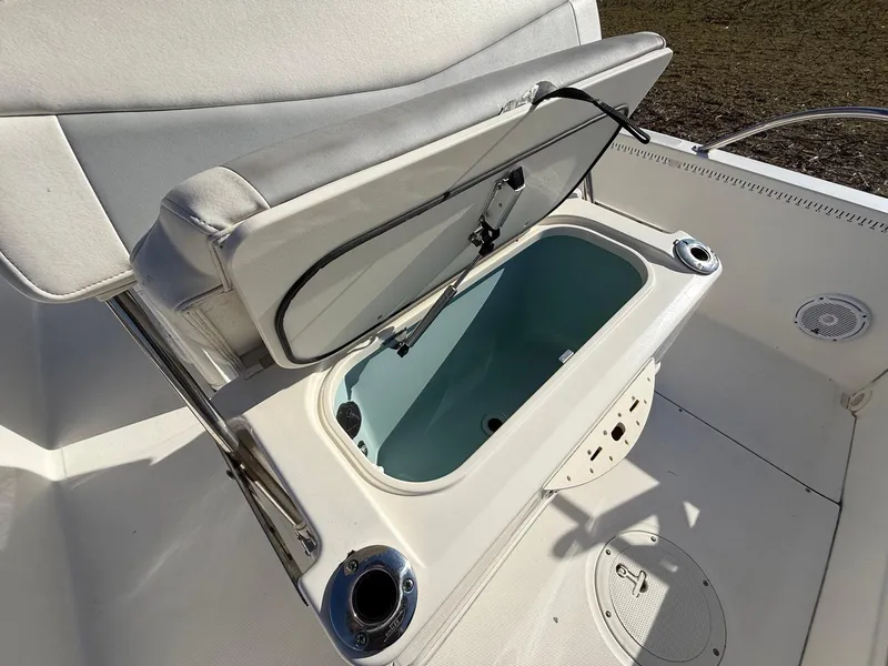Slide: The Image of 2016 Boston Whaler 240 Dauntless boat with open storage compartment. - 17