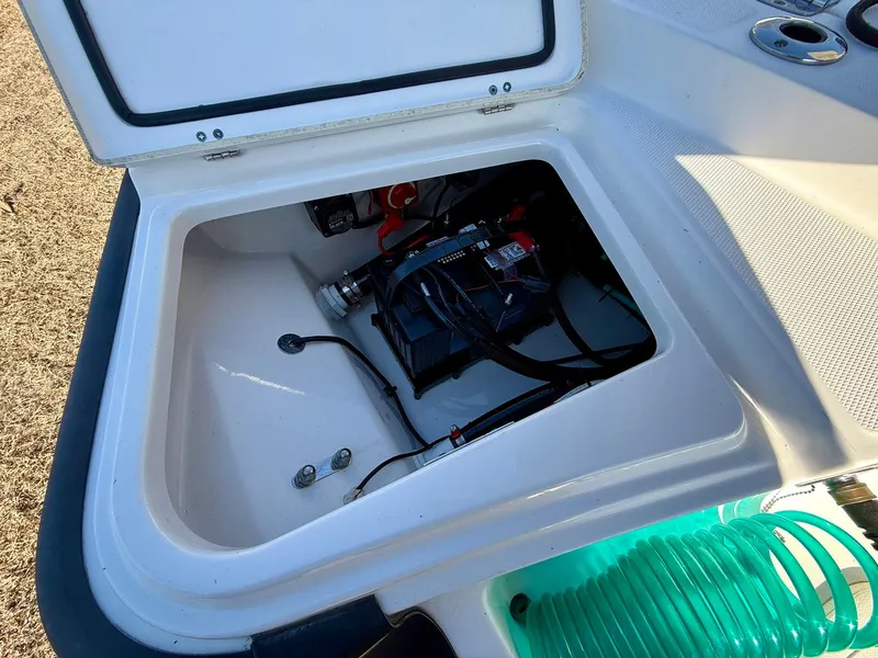 Slide: The Image of Open storage compartment in 2016 Boston Whaler 240 Dauntless boat. - 22