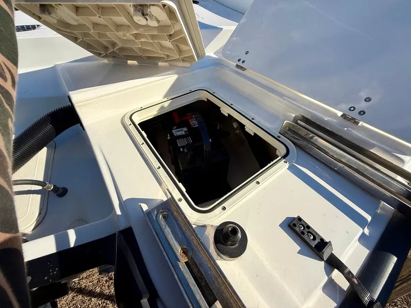 Slide: The Image of 2016 Boston Whaler 240 Dauntless boat battery compartment with open hatch. - 25