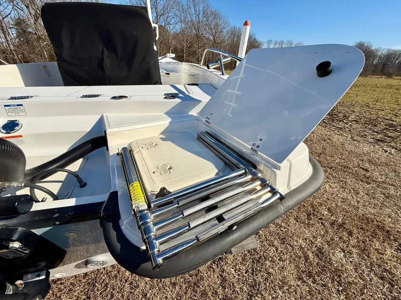 Slide: The Image of 2016 Boston Whaler 240 Dauntless boat with foldable ladder on deck. - 26