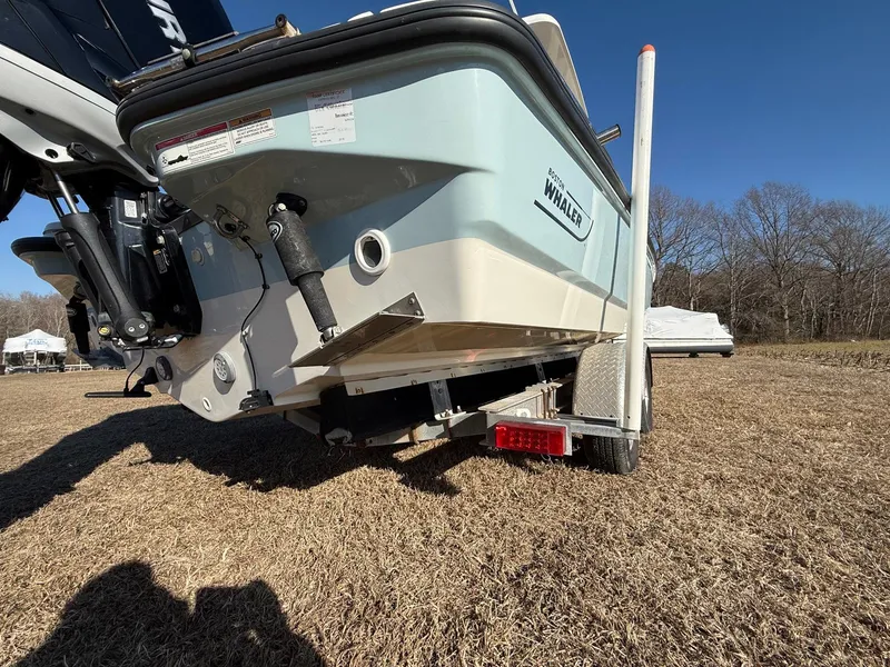 Slide: The Image of 2016 Boston Whaler 240 Dauntless boat on trailer, rear view, outdoors. - 29