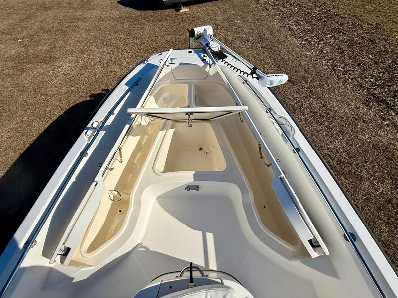 Slide: The Image of 2016 Boston Whaler 240 Dauntless boat deck, featuring spacious seating and storage. - 9