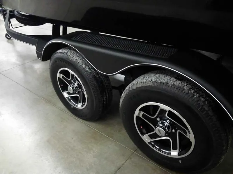 Slide: The Image of 2025 Ranger VX1888 WT trailer wheels, dual axle, black finish, indoor showroom. - 11