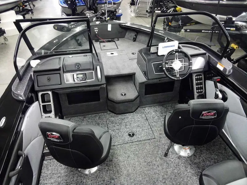 Slide: The Image of 2025 Ranger VX1888 WT boat interior with dual seats, steering wheel, and control panel. - 14