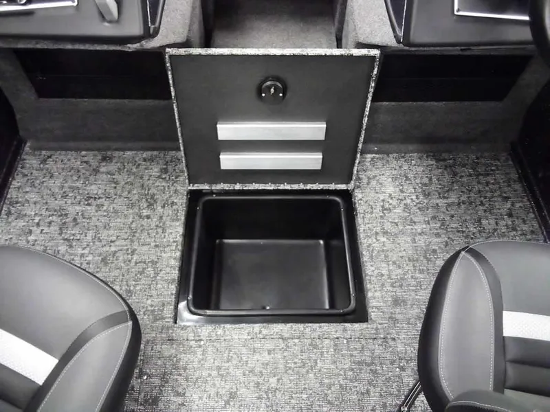 Slide: The Image of 2025 Ranger VX1888 WT interior storage compartment with open lid and carpeted flooring. - 15