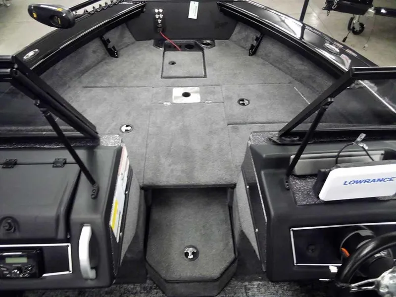 Slide: The Image of 2025 Ranger VX1888 WT boat interior with carpeted deck and Lowrance electronics. - 16