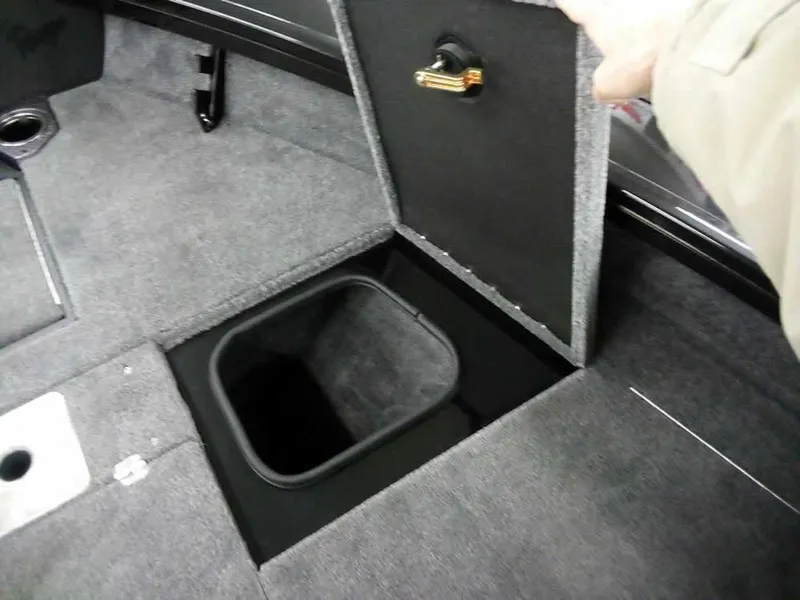 Slide: The Image of Storage compartment in 2025 Ranger VX1888 WT boat, featuring carpeted interior and secure latch. - 19