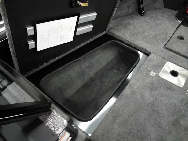 Slide: The Image of Interior storage compartment of 2025 Ranger VX1888 WT boat, featuring carpeted flooring. - 20