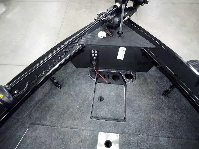 Slide: The Image of 2025 Ranger VX1888 WT boat interior with carpeted deck and control panel. - 21