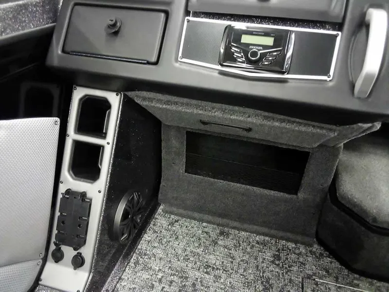 Slide: The Image of Interior of 2025 Ranger VX1888 WT boat, featuring dashboard and audio system. - 24