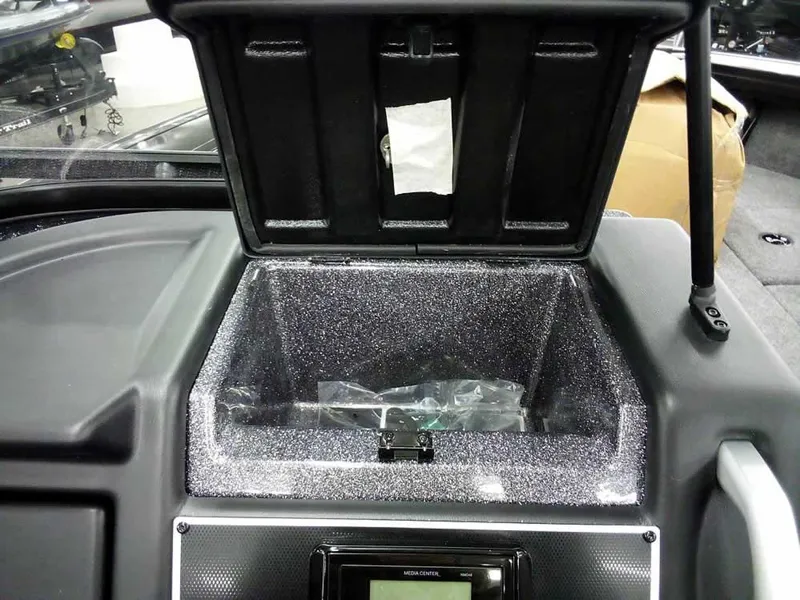 Slide: The Image of Open storage compartment in 2025 Ranger VX1888 WT boat dashboard. - 26