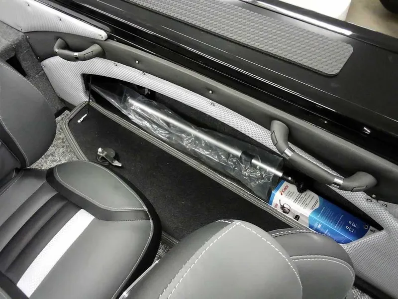 Slide: The Image of 2025 Ranger VX1888 WT interior storage compartment with seats and equipment. - 31