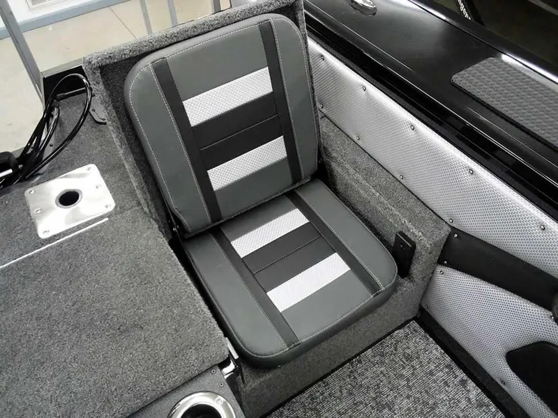 Slide: The Image of 2025 Ranger VX1888 WT boat seat, gray and black design, with cup holder and textured flooring. - 34