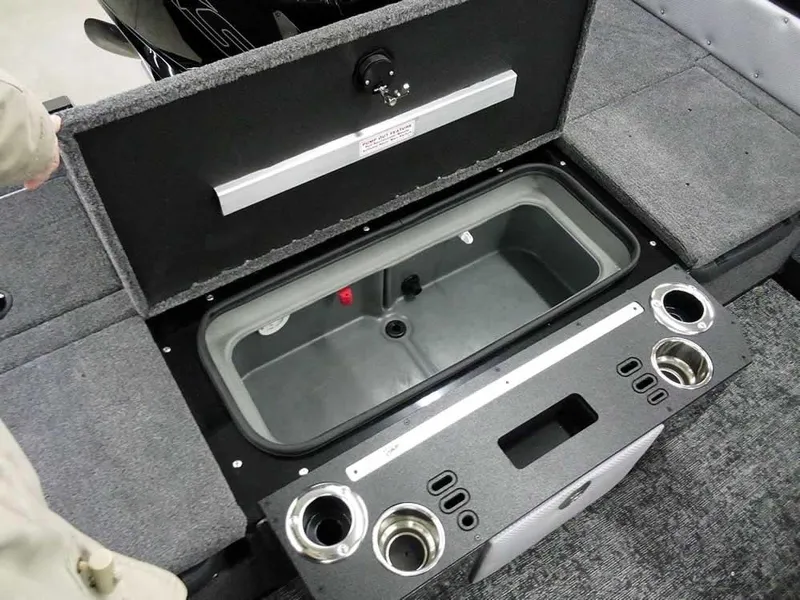Slide: The Image of 2025 Ranger VX1888 WT boat interior with open storage compartment and cup holders. - 38