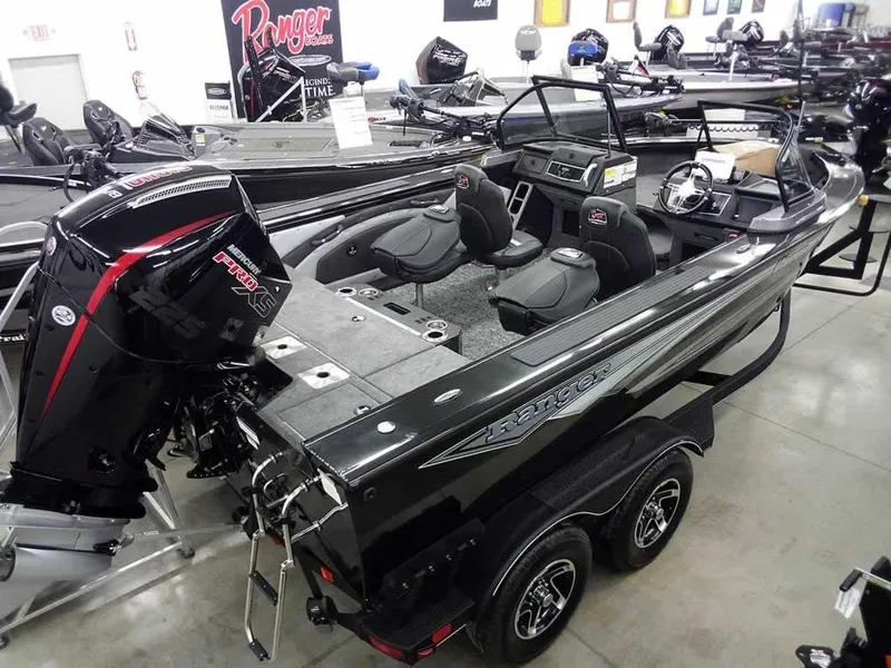 Slide: The Image of 2025 Ranger VX1888 WT boat with powerful outboard motor in showroom display. - 39