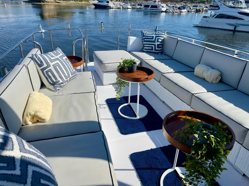 Slide: The Image of Luxurious seating area on a 2003 Ocean Alexander 510 Classico yacht, featuring elegant decor. - 13