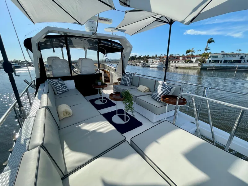 Slide: The Image of Luxurious 2003 Ocean Alexander 510 Classico yacht with spacious outdoor seating and waterfront view. - 16