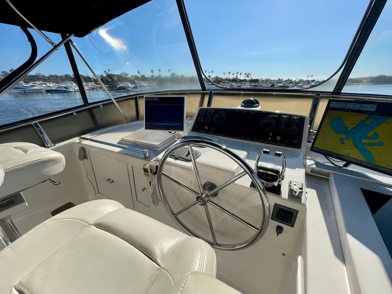 Slide: The Image of Helm of 2003 Ocean Alexander 510 Classico yacht with navigation equipment and steering wheel. - 20