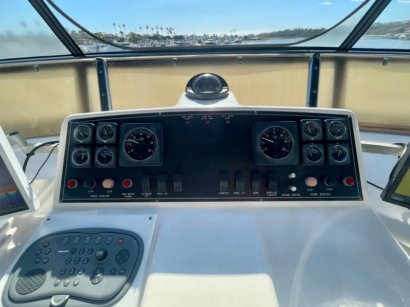 Slide: The Image of Helm of 2003 Ocean Alexander 510 Classico yacht with navigational instruments and controls. - 22