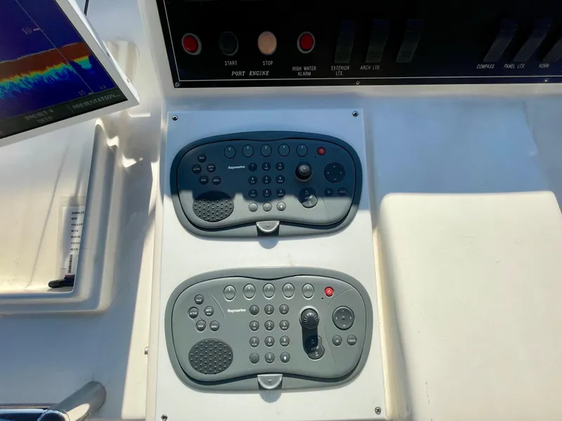 Slide: The Image of Control panel of a 2003 Ocean Alexander 510 Classico yacht, featuring navigation equipment. - 24