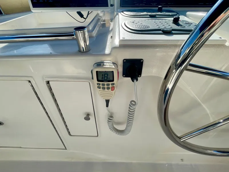 Slide: The Image of 2003 Ocean Alexander 510 Classico helm with radio and steering wheel. - 26