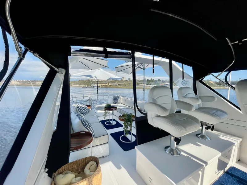 Slide: The Image of Luxurious interior of 2003 Ocean Alexander 510 Classico yacht with white seating and scenic views. - 30