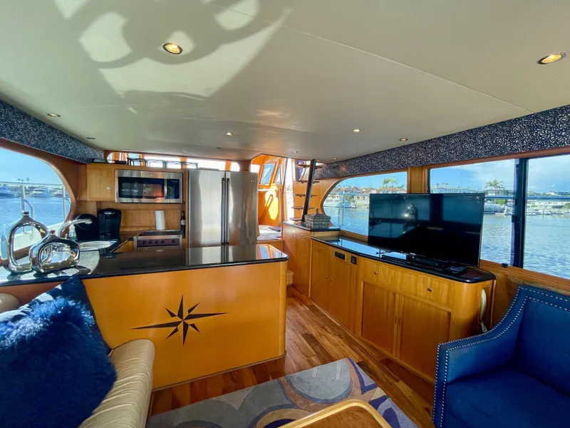 Slide: The Image of Luxurious interior of 2003 Ocean Alexander 510 Classico yacht with modern kitchen and seating area. - 31
