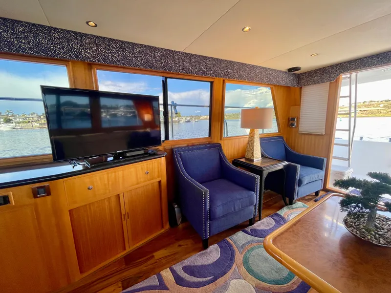 Slide: The Image of Luxurious interior of 2003 Ocean Alexander 510 Classico yacht with elegant seating and scenic views. - 34
