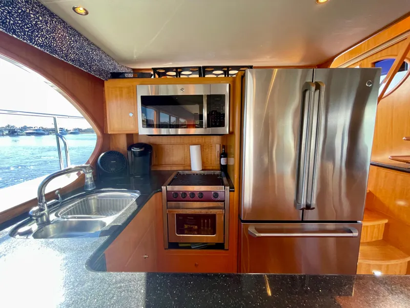 Slide: The Image of Luxurious kitchen interior of 2003 Ocean Alexander 510 Classico yacht with modern appliances. - 39