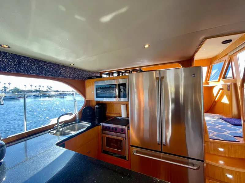 Slide: The Image of Luxurious kitchen interior of 2003 Ocean Alexander 510 Classico yacht with stainless steel appliances. - 40