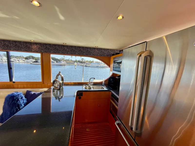 Slide: The Image of Luxurious kitchen interior of 2003 Ocean Alexander 510 Classico yacht with scenic water view. - 41