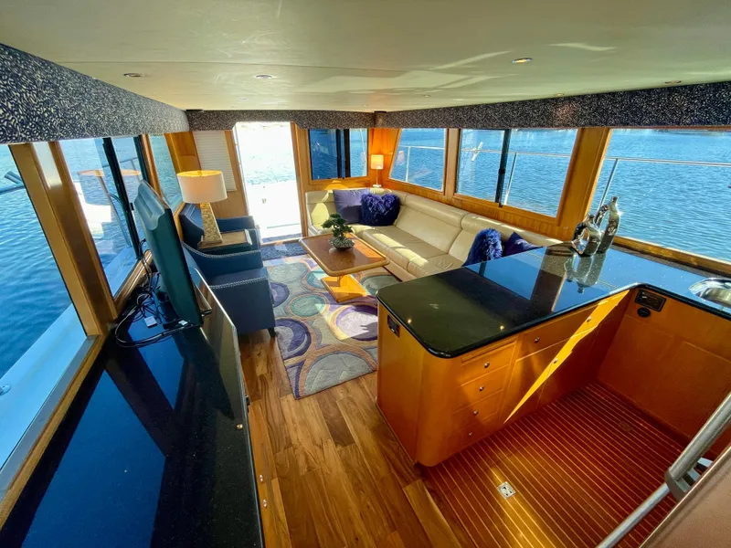 Slide: The Image of Luxurious interior of 2003 Ocean Alexander 510 Classico yacht with elegant furnishings and panoramic windows. - 42