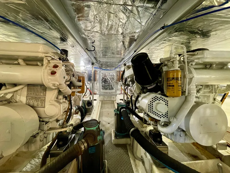 Slide: The Image of Engine room of 2003 Ocean Alexander 510 Classico yacht, showcasing dual engines and mechanical systems. - 47