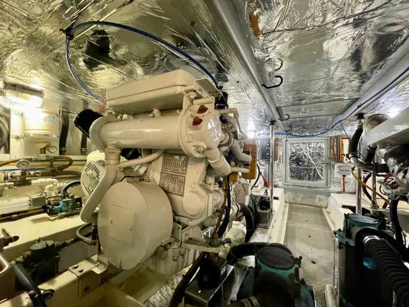 Slide: The Image of Engine room of 2003 Ocean Alexander 510 Classico yacht, showcasing machinery and equipment. - 49