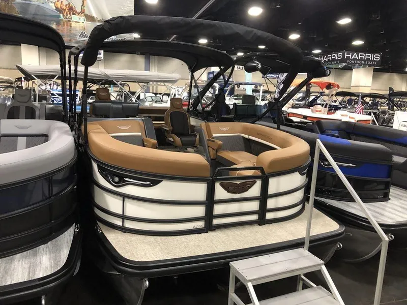 The Image of 2025 Bennington M Swingback 22 MSB pontoon boat displayed at indoor boat show. - 1