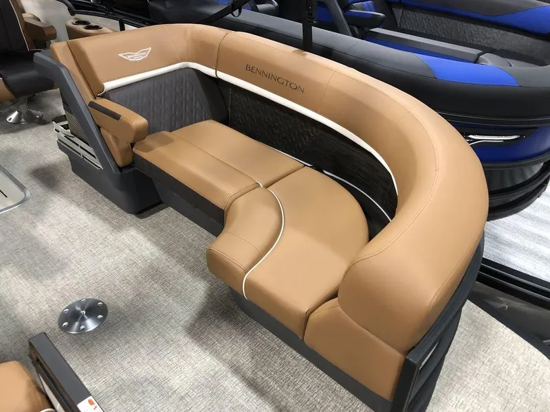 Slide: The Image of 2025 Bennington M Swingback 22 MSB boat seating, featuring luxurious tan upholstery. - 4