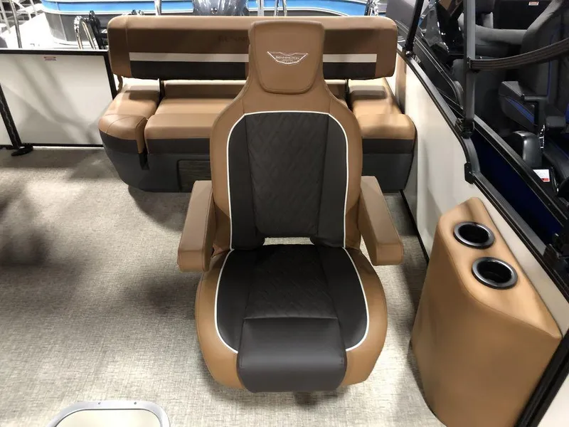 Slide: The Image of 2025 Bennington M Swingback 22 MSB boat interior with luxurious seating and cup holders. - 6
