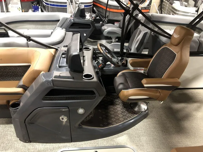 Slide: The Image of 2025 Bennington M Swingback 22 MSB boat interior with modern helm and seating. - 8