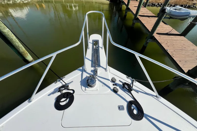 Slide: The Image of Bow view of 1999 Viking 55 yacht docked at marina. - 11