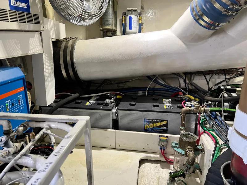 Slide: The Image of Engine room of 1999 Viking 55 yacht with batteries and ventilation system. - 52