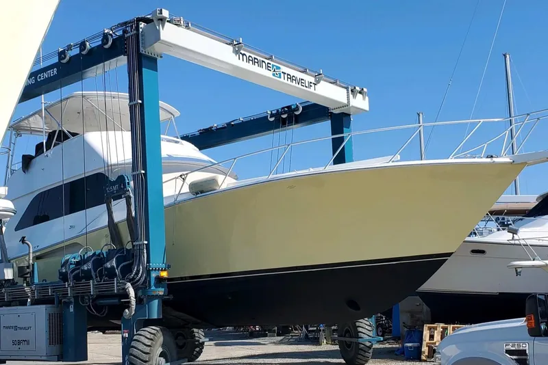 Slide: The Image of 1999 Viking 55 yacht on a Marine Travelift at a boatyard. - 55