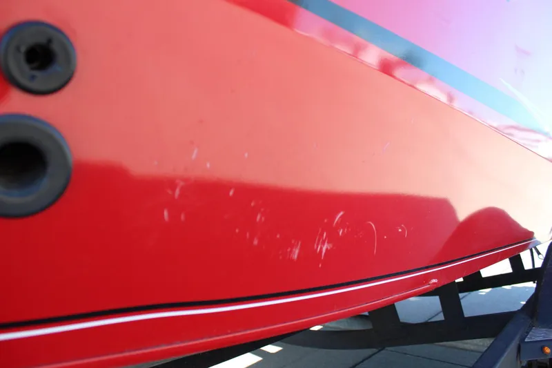 Slide: The Image of Red 2018 Tracker Pro Guide V-175 SC boat hull with minor scratches. - 10