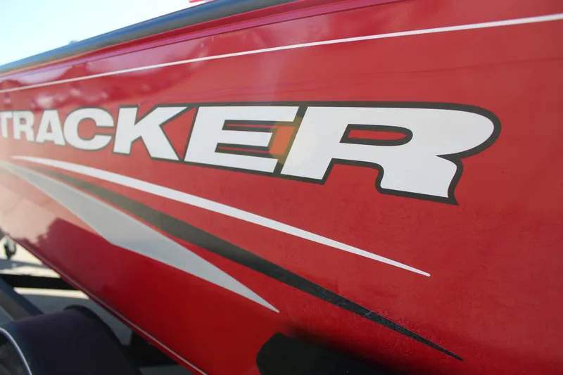 Slide: The Image of Red 2018 Tracker Pro Guide V-175 SC boat with bold logo and sleek design. - 12